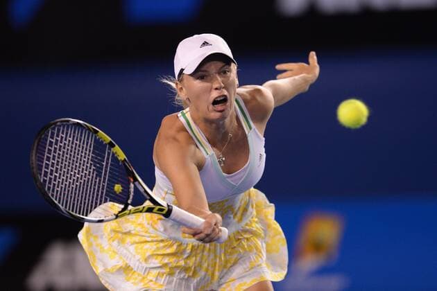 (140116) -- MELBOURNE, Jan. 16, 2014 (Xinhua) -- Denmark s Caroline Wozniacki plays a shot during her women s singles match on day four of the 2014 Australian Open tennis tournament in Melbourne on January 16, 2014. 