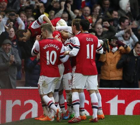Arsenal s Santi Cazorla celebrates scoring his sides opening goal - Arsenal FC London vs Fulham FC - - Premier League - Emirates Stadium- London - England - 18 01 2014 - Pic DavidKlein Sportimage EDITORIAL USE ONLY. No use with unauthorised audio, video, data, fixture lists, club league logos or live services. Online in-match use limited to 120 images, no video emulation. No use in betting, games or single club league player publications.
