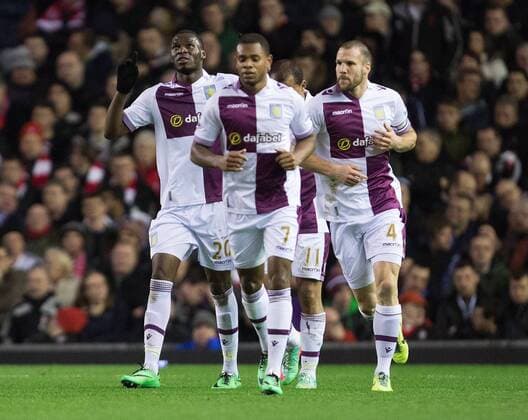 Christian Benteke of Aston Villa celebrates scoring his sides second goal - Liverpool FC vs. Aston Villa - Barclays Premier League - Anfield - Liverpool - 18 01 2014 Pic PhilipxOldham Sportimage EDITORIAL USE ONLY. No use with unauthorised audio, video, data, fixture lists, club league logos or live services. Online in-match use limited to 120 images, no video emulation. No use in betting, games or single club league player publications.