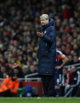Arsenal s Arsene Wenger looks on - FC Arsenal vs FC Fulham - - Premier League - Emirates Stadium- London - England - 18 01 2014 - Pic David Klein Sportimage EDITORIAL USE ONLY. No use with unauthorised audio, video, data, fixture lists, club league logos or live services. Online in-match use limited to 120 images, no video emulation. No use in betting, games or single club league player publications.