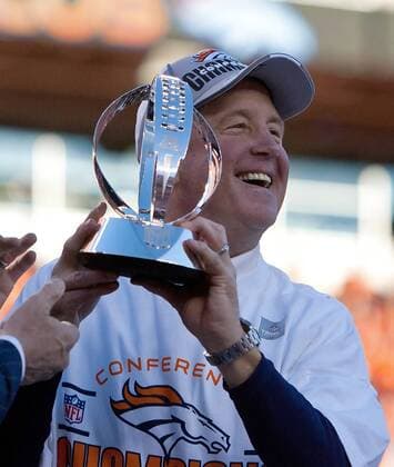 Jan. 19, 2014 - Denver, Colorado, U.S - Broncos Head Coach JOHN FOX celebrates with the AFC Championship Trophy at the end of the game at Sports Authority Field at Mile High during the AFC Championship Game Sunday afternoon. The Broncos beat the Patriots 26-16. NFL American Football Herren USA AFC Championship 2014 - Broncos beat the Patriots 26-16  - ZUMAion