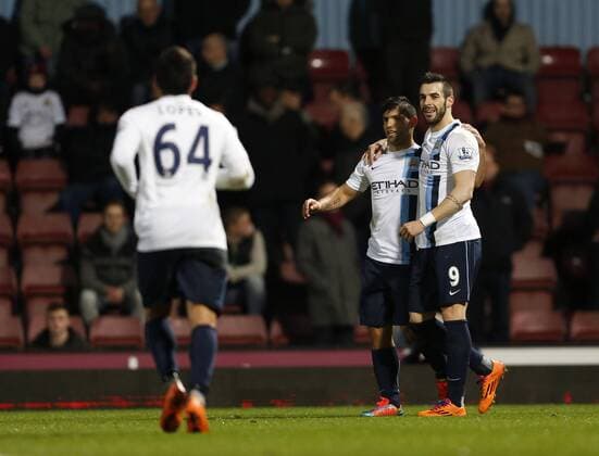 Manchester City s Sergio Kun Aguero celebrates scoring his sides second goal West Ham United vs Manchester City - League Cup Semi Final, Second Leg - Upton Park - London - England - 21 01 2014 - Pic David Klein Sportimage EDITORIAL USE ONLY. No use with unauthorised audio, video, data, fixture lists, club league logos or live services. Online in-match use limited to 120 images, no video emulation. No use in betting, games or single club league player publications.