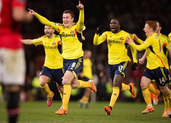 Craig Gardner of Sunderland FC leads celebrations as Sunderland FC victor on penalties - Manchester United (ManU) vs. Sunderland FC - Capital One Cup Semi Final Second Leg - Old Trafford - Manchester - 22 01 2014 Pic Philip Oldham Sportimage EDITORIAL USE ONLY. No use with unauthorised audio, video, data, fixture lists, club league logos or live services. Online in-match use limited to 120 images, no video emulation. No use in betting, games or single club league player publications.