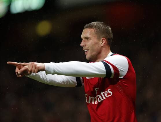 Arsenal s Lukas Podolski celebrates scoring his sides opening goal Arsenal vs Coventry City - FA Cup Fourth Round - Emirates Stadium - London - England - 24 01 2014 - Pic David Klein Sportimage EDITORIAL USE ONLY. No use with unauthorised audio, video, data, fixture lists, club league logos or live services. Online in-match use limited to 120 images, no video emulation. No use in betting, games or single club league player publications.