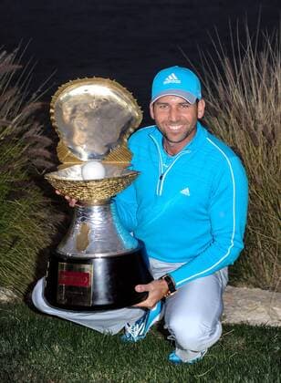 Sergio Garcia of Spain holds the winner s trophy after the final round of the Commercial Bank Qatar Masters at the Doha Golf Club in Doha, Qatar, Jan. 25, 2014. Garcia claimed the title after he birdied the third extra hole to beat Finland s Mikko Ilonen in a playoff. (Xinhua Chen Shaojin) (SP)QATAR-DOHA-GOLF-MASTERS 