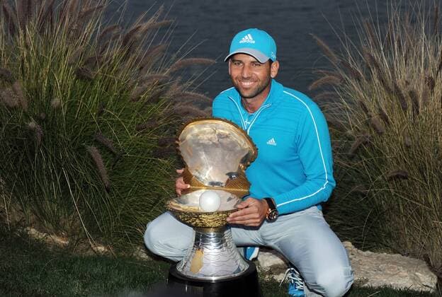 Sergio Garcia of Spain holds the winner s trophy after the final round of the Commercial Bank Qatar Masters at the Doha Golf Club in Doha, Qatar, Jan. 25, 2014. Garcia claimed the title after he birdied the third extra hole to beat Finland s Mikko Ilonen in a playoff. (Xinhua Chen Shaojin) (SP)QATAR-DOHA-GOLF-MASTERS 