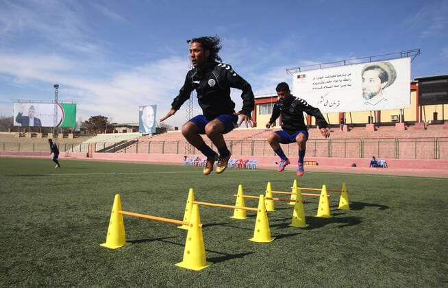 (140129) -- Kabul, Jan. 29, 2014 (Xinhua) -- Members of the national soccer team exercises in Kabul Stadium in Kabul, Afghanistan on January 29, 2014. Afghan National Football Team players receive training for Asian Challenge Cup to be held in Maldives in May this year. Afghanistan won its first international trophy in soccer beating India in the final of the South Asian Football Federation (SAFF) championship held in Kathmandu, Nepal in September last year. (Xinhua Ahmad Massoud) (SP)AFGHANISTAN-KABUL-NATIONAL SOCCER TEAM TRAINING 
