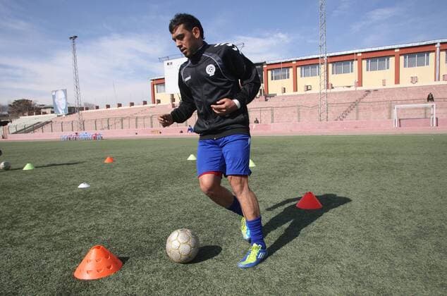 (140129) -- Kabul, Jan. 29, 2014(Xinhua) -- A member of national soccer team exercises in Kabul Stadium in Kabul, Afghanistan on January 29, 2014. Afghan National Football Team players receive training for Asian Challenge Cup to be held in Maldives in May this year. Afghanistan won its first international trophy in soccer beating India in the final of the South Asian Football Federation (SAFF) championship held in Kathmandu, Nepal in September last year. (Xinhua Ahmad Massoud) (SP)AFGHANISTAN-KABUL-NATIONAL SOCCER TEAM TRAINING 