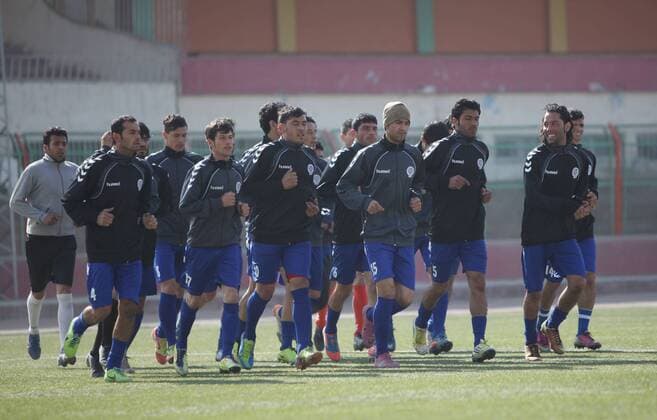 (140129) -- Kabul, Jan. 29, 2014 (Xinhua) -- Afghan national soccer team runs during their exercise in Kabul Stadium in Kabul, Afghanistan on January 29, 2014. Afghan National Football Team players receive training for Asian Challenge Cup to be held in Maldives in May this year. Afghanistan won its first international trophy in soccer beating India in the final of the South Asian Football Federation (SAFF) championship held in Kathmandu, Nepal in September last year. (Xinhua Ahmad Massoud) (SP)AFGHANISTAN-KABUL-NATIONAL SOCCER TEAM TRAINING 
