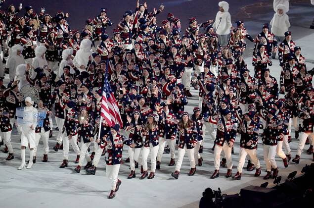 Feb. 7, 2014 - Sochi, RUS - Flag bearer Todd Lodwick and the USA team enters Fisht Olympic Stadium in Sochi, Russia, during the Opening Ceremony for the Winter Olympics, Friday, Feb. 7, 2014. Sochi Winter Olympics Opening Ceremony - ZUMAm67