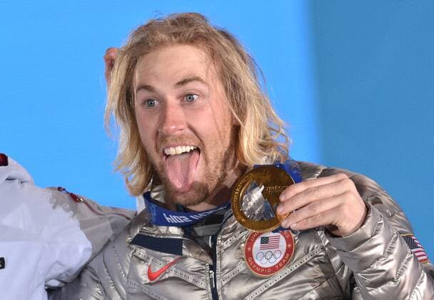 Slopestyle gold medalist Olympiasieger Sage Kotsenburg celebrates with his medal during his victory ceremony at the Sochi 2014 Winter Olympics on February 7, 2014 in Sochi, Russia.  OLY20140208329