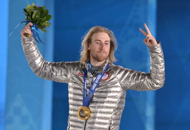 Slopestyle gold medalist Olympiasieger Sage Kotsenburg celebrates with his medal during his victory ceremony at the Sochi 2014 Winter Olympics on February 7, 2014 in Sochi, Russia.  OLY20140208331