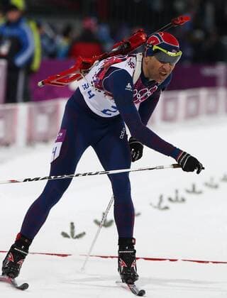 ITAR-TASS: SOCHI, RUSSIA. FEBRUARY 8, 2014. Biathlete Ole Einar Bjoerndalen of Norway crosses the finish lina as he wins the men s 10 km sprint at the Sochi 2014 Winter Olympics, at Laura biathlon & ski complex.  RE1386AB