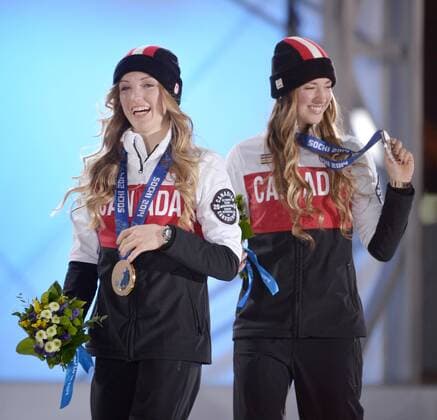 Canada s Justine Dufour-Lapointe (L) and Chloe Dufour-Lapointe hold their gold and silver medals in freestyle skiing ladies moguls after a victory ceremony at the Sochi 2014 Winter Olympics on February 9, 2014 in Sochi.  OLY20140209156