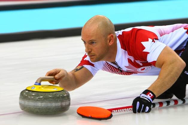 (140210) -- SOCHI, Feb. 10, 2014 (Xinhua) -- Canada s vice-skip Ryan Fry throws the stone during the men s curling round robin session 1 against Germany at the 2014 Sochi Winter Olympic Games in Sochi, Russia, Feb. 10, 2014. Canada won 11-8. (Xinhua Gong Bing) (SP)OLY-RUSSIA-SOCHI-CURLING-MEN-CANADA VS GERMANY 