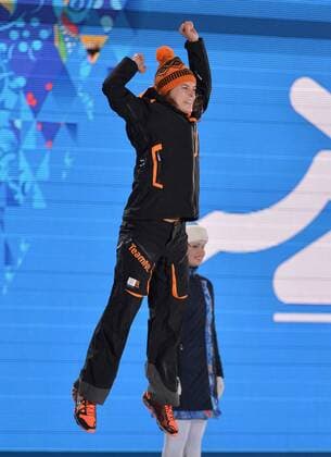 The Netherland s Ireen Wüst celebrates before being presented with a gold medal during the victory ceremony for ladies 3000M speed skating at the Sochi 2014 Winter Olympics on February 10, 2014 in Sochi, Russia.  OLY20140210156