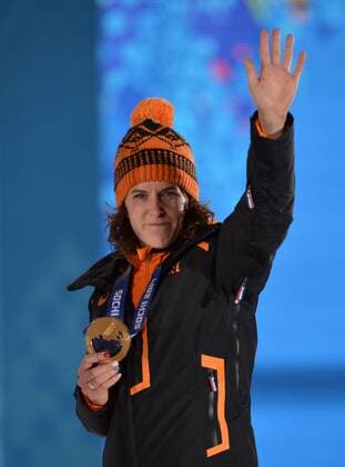 The Netherland s Ireen Wüst waves to the crowd after receiving a gold medal during the victory ceremony for ladies 3000M speed skating at the Sochi 2014 Winter Olympics on February 10, 2014 in Sochi, Russia.  OLY20140210163