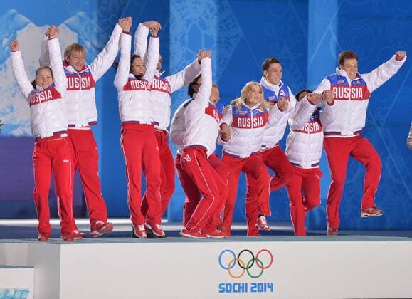 The Russian team celebrates during their victory ceremony for the figure skating team event at the Sochi 2014 Winter Olympics on February 10, 2014 in Sochi, Russia. Russia won a gold medal in the event.  OLY20140210192