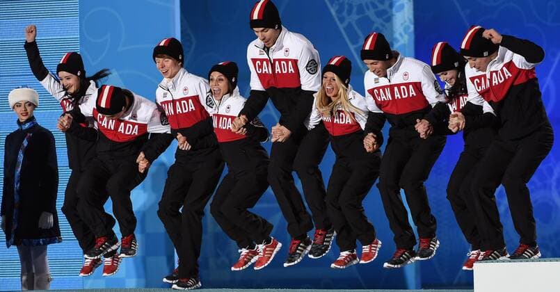 (140210) -- SOCHI, Feb. 10, 2014 (Xinhua) -- Skaters of Canada figure skating team jump onto the podium at the victory ceremony for the figure skating team event in the Sochi 2014 Winter Olympic Games in Sochi, Russia, Feb. 10, 2014. Canada won the silver medal with 65 scores.(Xinhua Wang Haofei) (SP)OLY-RUSSIA-SOCHI-FIGURE SKATING-TEAM-VICTORY CEREMONY 