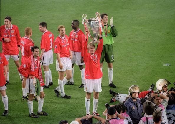 David Beckham celebrates with the trophy - UEFA Champions League final 1999 - Manchester United vs Bayern Munich at the Now Camp Stadium, Barcelona, Spain - 26th May 1999 Pictures Simon Bellis Sportimage EDITORIAL USE ONLY. No use with unauthorised audio, video, data, fixture lists, club league logos or live services. Online in-match use limited to 120 images, no video emulation. No use in betting, games or single club league player publications.