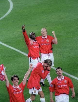Andy Cole and Japp Stam celebrate the win - UEFA Champions League final 1999 - Manchester United vs Bayern Munich at the Now Camp Stadium, Barcelona, Spain - 26th May 1999 Pictures Simon Bellis Sportimage EDITORIAL USE ONLY. No use with unauthorised audio, video, data, fixture lists, club league logos or live services. Online in-match use limited to 120 images, no video emulation. No use in betting, games or single club league player publications.
