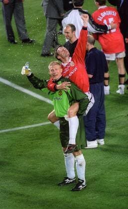 Peter Schmeichel and Teddy Sheringham celebrate - UEFA Champions League final 1999 - Manchester United vs Bayern Munich at the Now Camp Stadium, Barcelona, Spain - 26th May 1999 Pictures Simon Bellis Sportimage EDITORIAL USE ONLY. No use with unauthorised audio, video, data, fixture lists, club league logos or live services. Online in-match use limited to 120 images, no video emulation. No use in betting, games or single club league player publications.