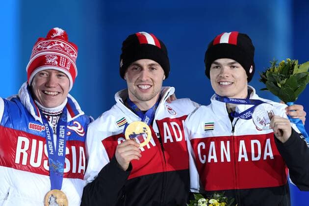 OLYMPIA - Olympische Spiele 2014 SOTSCHI,RUSSLAND,11.FEB.14 - DIVERS, OLYMPIA, FREE SKI, FREESTYLE SKIING - Olympische Winterspiele Sotschi 2014, Moguls, Herren, Siegerehrung, Medaillenvergabe am Medal Plaza. Bild zeigt Alexandr Smyshlyaev (RUS), Alex Bilodeau und Mikael Kingsbury (CAN). Keywords: Medaille.