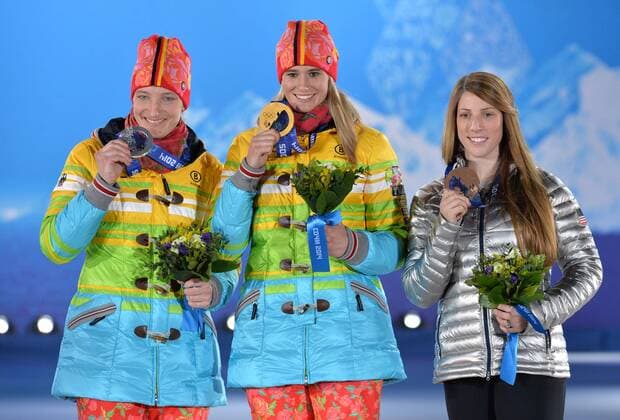 From left to right, silver medalist Germany s Tatjana Hüfner, gold medalist Germany s Natalie Geisenberger and bronze medalist United State s Erin Hamlin pose during the victory ceremony for luge women s single at the Sochi 2014 Winter Olympics on February 12, 2014 in Sochi, Russia.  OLY20140212375