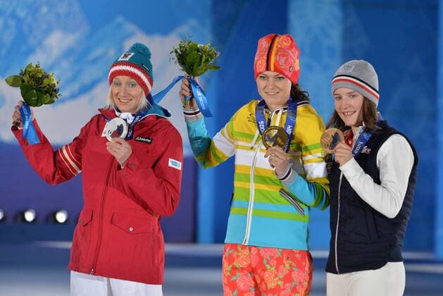 From left to right, silver medalist Austria s Daniela Iraschko-Stolz, gold medalist Germany s Carina Vogt and bronze medalist France s Coline Mattel during the victory ceremony for the ski jumping ladies normal hill individual at the Sochi 2014 Winter Olympics on February 12, 2014 in Sochi, Russia.  OLY20140212380