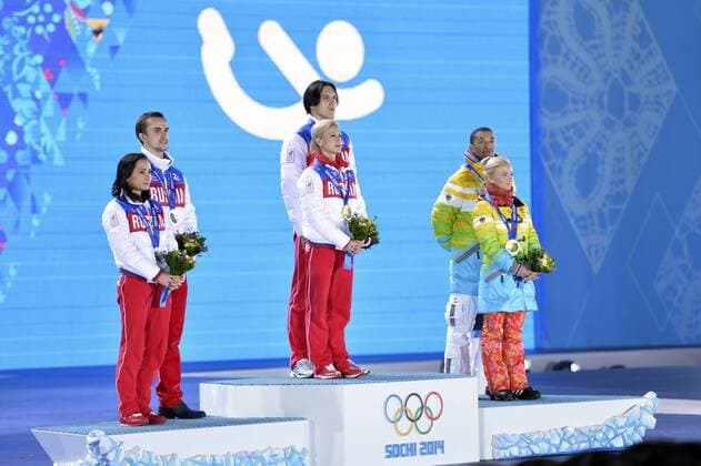 Left to right, Russia s Ksenia Stolbova and Fedor Klimov, Russia s Tatiana Volosozhar and Maxim Trankov and Germany s Aliona Savchenko and Robin Szolkowy pose with their silver, bronze and gold medals during the victory ceremony for figure skating pairs at the Sochi 2014 Winter Olympics on February 13, 2014 in Sochi, Russia.  OLY20140213464