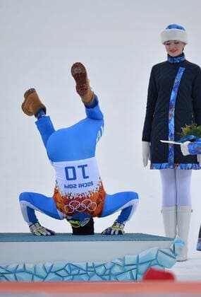 Italy s Christof Innerhofer celebrates after winning bronze in the men s super combined at the Sochi 2014 Winter Olympics on February 14, 2014 in Krasnaya Polyana, Russia.  OLY20140214316