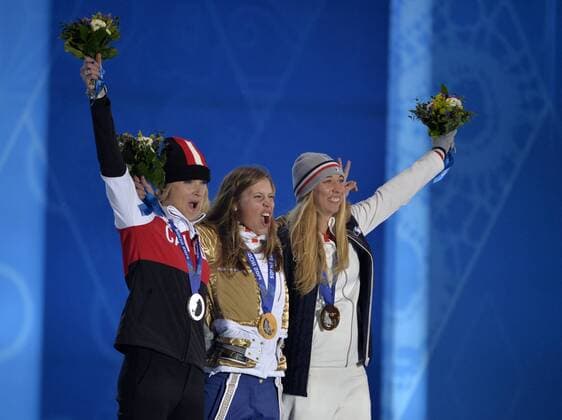 Canada s Dominique Maltais (L-R), Czech Republic s Eva Samkova and France s Chloe Trespeuch during the victory ceremony for ladies snowboard-cross at the Sochi 2014 Winter Olympics on February 16, 2014 in Sochi, Russia. Maltais won silver, Samkova gold and Trespeuch bronze in the event.  OLY20140216164