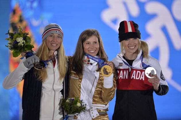 Canada s Dominique Maltais (R-L), Czech Republic s Eva Samkova and France s Chloe Trespeuch during the victory ceremony for ladies snowboard-cross at the Sochi 2014 Winter Olympics on February 16, 2014 in Sochi, Russia. Maltais won silver, Samkova gold and Trespeuch bronze in the event.  OLY20140216167