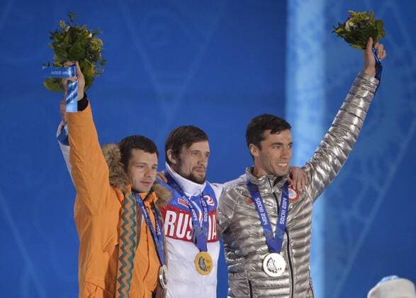 Latvia s Martins Dukurs, Russia s Alexander Tretiakov and United States Matthew Antoine celebrate their silver, gold and bronze medals during the victory ceremony for men s skeleton at the Sochi 2014 Winter Olympics on February 16, 2014 in Sochi, Russia.  OLY20140216730