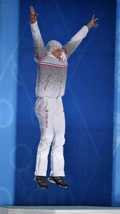 Poland s Zbigniew Brodka jumps while celebrating his gold medal during the victory ceremony for men s speed skating 1500M at the Sochi 2014 Winter Olympics on February 16, 2014 in Sochi, Russia.  OLY20140216739