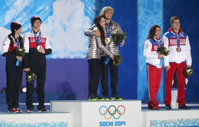Sochi, Krasnodar Krai, Russia - USA s Figure Skating Ice Dance Free Dance Gold medalists(center) Charlie WHITE and Meryl Davis(middle) enter the stage to accept their Gold medals duirng the Winter Olympics on February 17 in Sochi, Russia. Figure Skating - Sochi 2014 - ZUMAa35