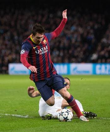 Martin Demichelis of Manchester City brings down Lionel Messi of Barcelona to earn a red card - UEFA Champions League First Knockout Round - Manchester City vs Barcelona - Etihad Stadium - Manchester - England - 18th February 2014 - Picture Phil Oldham Sportimage EDITORIAL USE ONLY. No use with unauthorised audio, video, data, fixture lists, club league logos or live services. Online in-match use limited to 120 images, no video emulation. No use in betting, games or single club league player publications.