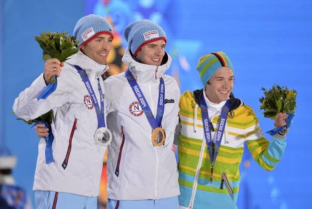 Norway s Magnus Hovdal Moan (L-R), Norway s Joergen Graabak and Germany s Fabian Riessle pose with their silver, gold and bronze medals during the victory ceremony for nordic combined individual Gunderson long hill 10km at the Sochi 2014 Winter Olympics on February 19, 2014 in Sochi, Russia.  OLY20140219135