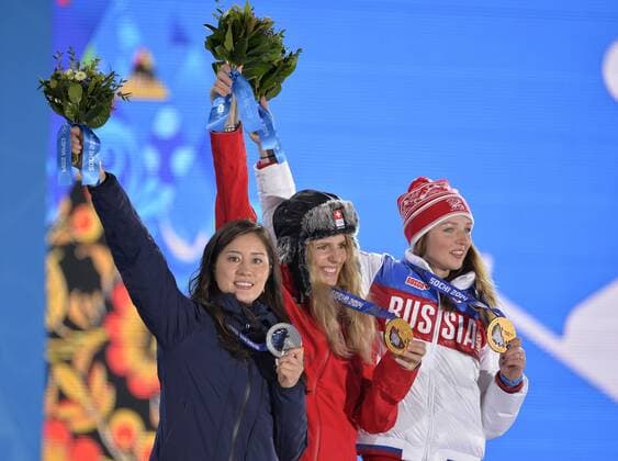 Japan s Tomoka Takeuchi (L-R), Switzerland s Patrizia Kummer and Russia s Alena Zavarzina celebrate their silver, gold and bronze medals during the victory ceremony for ladies snowboard parallel giant slalom at the Sochi 2014 Winter Olympics on February 19, 2014 in Sochi, Russia.  OLY20140219160
