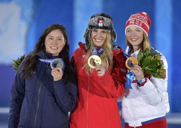 Japan s Tomoka Takeuchi (L-R), Switzerland s Patrizia Kummer and Russia s Alena Zavarzina hold their silver, gold and bronze medals during the victory ceremony for ladies snowboard parallel giant slalom at the Sochi 2014 Winter Olympics on February 19, 2014 in Sochi, Russia.  OLY20140219164