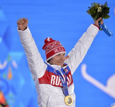 Russia s Vic Wild celebrates his gold medal during the victory ceremony for men s snowboard parallel giant slalom at the Sochi 2014 Winter Olympics on February 19, 2014 in Sochi, Russia.  OLY20140219171