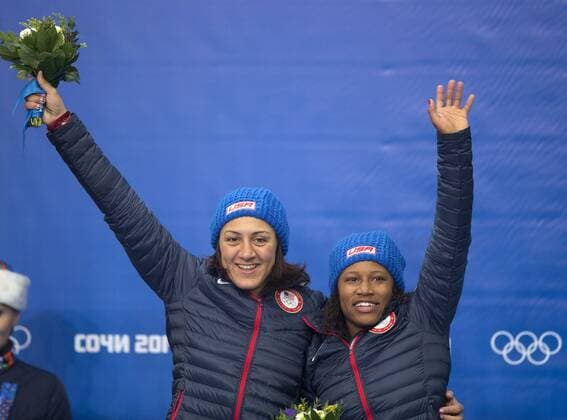 (140219) -- SOCHI, Feb. 19, 2014 (Xinhua) -- Silver medalists Elana Meyers (L) and Lauryn Williams of the United States celebrate during the flower ceremony for women s bobsleigh at the 2014 Sochi Winter Olympic Games in Sochi, Russia, Feb. 19, 2014. (Xinhua Fei Maohua) (SP)OLY-RUSSIA-SOCHI-WOMEN S BOBSLEIGH 