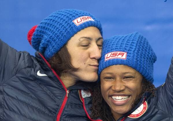 (140219) -- SOCHI, Feb. 19, 2014 (Xinhua) -- Silver medalists Elana Meyers (L) and Lauryn Williams of the United States celebrate during the flower ceremony for women s bobsleigh at the 2014 Sochi Winter Olympic Games in Sochi, Russia, Feb. 19, 2014. (Xinhua Fei Maohua) (SP)OLY-RUSSIA-SOCHI-WOMEN S BOBSLEIGH 