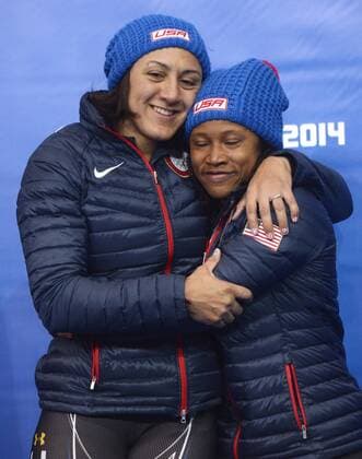 Feb. 19, 2014 - Sochi, RUS - USA-1 bobsled driver Elana Meyers hugs teammate Lauryn Williams after placing second in the women s bobsled finals during the Winter Olympics on Wednesday, Feb. 19, 2014, in Sochi, Russia. SOCHI OLYMPIC GAMES WOMEN S BOBSLED, BOBSLEIGH - ZUMAm67