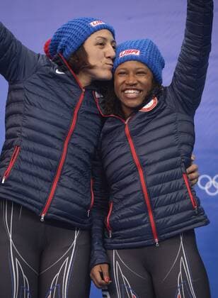 Feb. 19, 2014 - Sochi, RUS - USA-1 bobsled driver Elana Meyers kisses teammate Lauryn Williams after placing second in the women s bobsled finals during the Winter Olympics on Wednesday, Feb. 19, 2014, in Sochi, Russia. SOCHI OLYMPIC GAMES WOMEN S BOBSLED, BOBSLEIGH - ZUMAm67