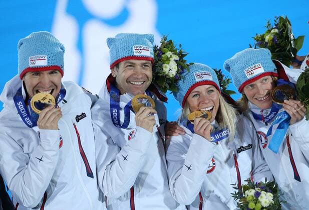 ITAR-TASS: SOCHI, RUSSIA. FEBRUARY 20, 2014. Gold medalists Emil Hegle Svendsen, Ole Einar Bjoerndalen, Tiril Eckhoff and Tora Berger of Norway (L-R) pose with their medals during a victory ceremony for the mixed biathlon relay event at the 22nd Winter Olympic Games, at Medals Plaza.  RE13A6B6
