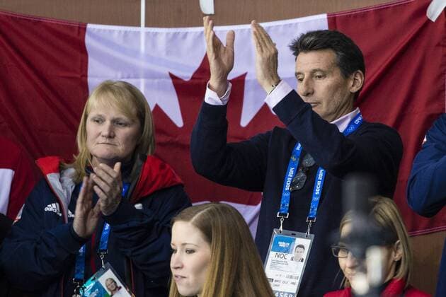 21.02.2014 Sochi, Krasnodar Krai, Russia. Lord Sebastian COE (centre) &amp; Curling coach Rhona HOWIE (left) applaud the Great Britain rink off the ice after conceding defeat in the Gold Medal Game of the Men s Curling competition from the Ice Cube Curling Centre, Coastal Cluster - XXII Olympic Winter Games xCraigxMercerx  ActionPlus20177033