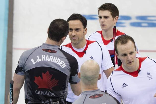 21.02.2014 Sochi, Krasnodar Krai, Russia. Shaking on it - Great Britain skip David MURDOCH congratulates Canada s E.J. HARNDEN after GB concede - during the Gold Medal Game of the Men s Curling competition from the Ice Cube Curling Centre, Coastal Cluster - XXII Olympic Winter Games xCraigxMercerx  ActionPlus20177036