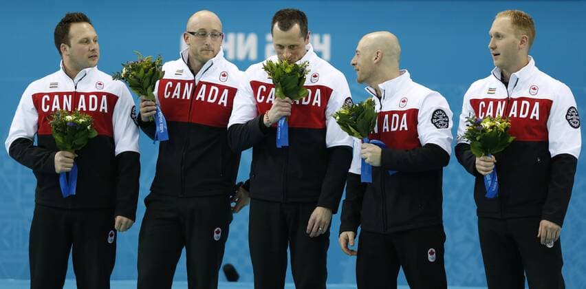 (140221) -- SOCHI, Feb. 21, 2014 (Xinhua) -- Players of Canada pose during the flower ceremony after the men s gold medal game of Curling between Canada and Great Britain at the 2014 Sochi Winter Olympic Games in Sochi, Feb. 21, 2014. Canada won 9-3 and claimed the gold medal of the event. (Xinhua Wang Lili) (SP)OLY-RUSSIA-SOCHI-CURLING-MEN S GOLD MEDAL GAME 