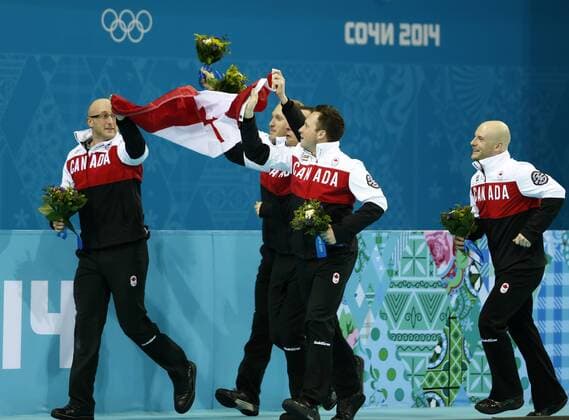 (140221) -- SOCHI, Feb. 21, 2014 (Xinhua) -- Players of Canada celebrate during the flower ceremony after the men s gold medal game of Curling at the 2014 Sochi Winter Olympic Games in Sochi, Feb. 21, 2014. Canada claimed the gold medal of the event. (Xinhua Wang Lili) (SP)OLY-RUSSIA-SOCHI-CURLING-MEN S GOLD MEDAL GAME 